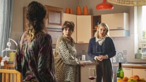 Three women talking in a kitchen in a scene from Twin Stars, screening at the 2026 ST. ALi Italian Film Festival.