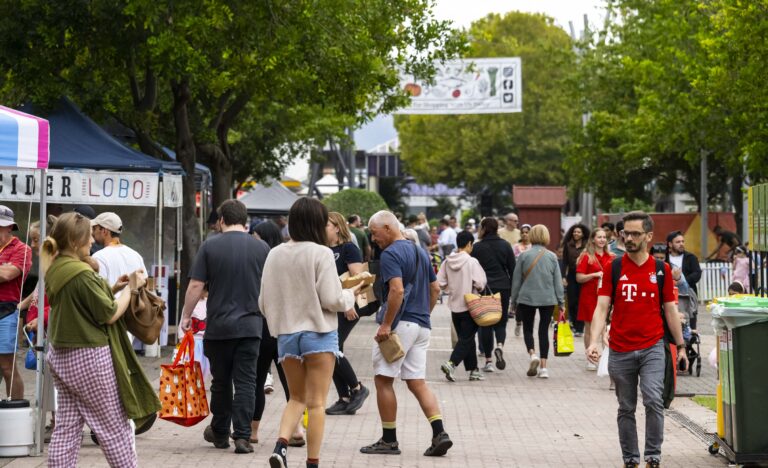 Shoppers exploring the outdoor Adelaide Showground Farmers’ Market along Kingsway Boulevard.